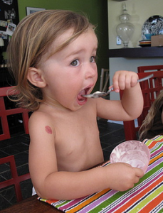 Little girl eating ice cream, homemade, I hope. What's in your ice cream?